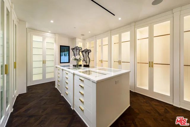 a kitchen with stove and cabinets