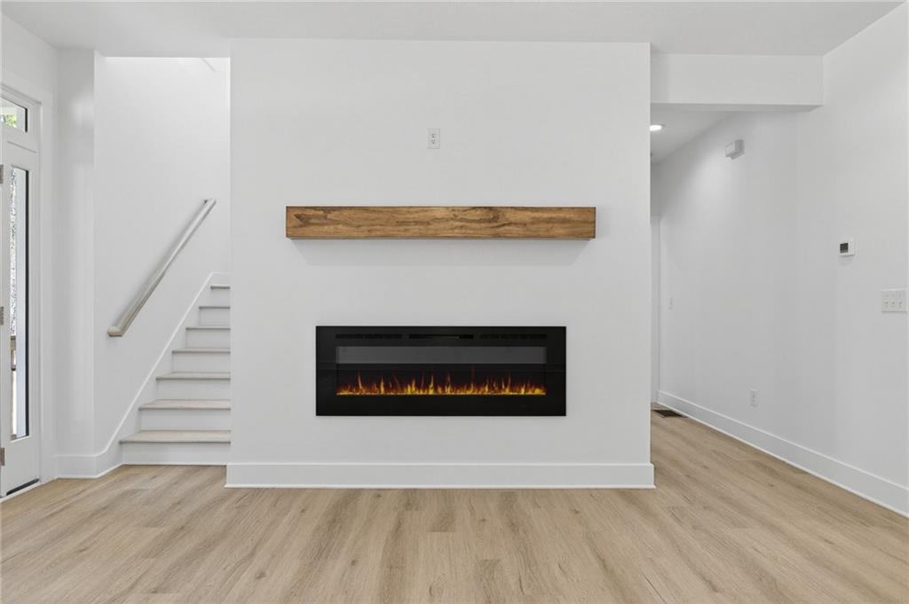 88 Carolyn Path Rockmart, GA 30153 - Photo 22 of 73 a view of an empty room with wooden floor and a fireplace