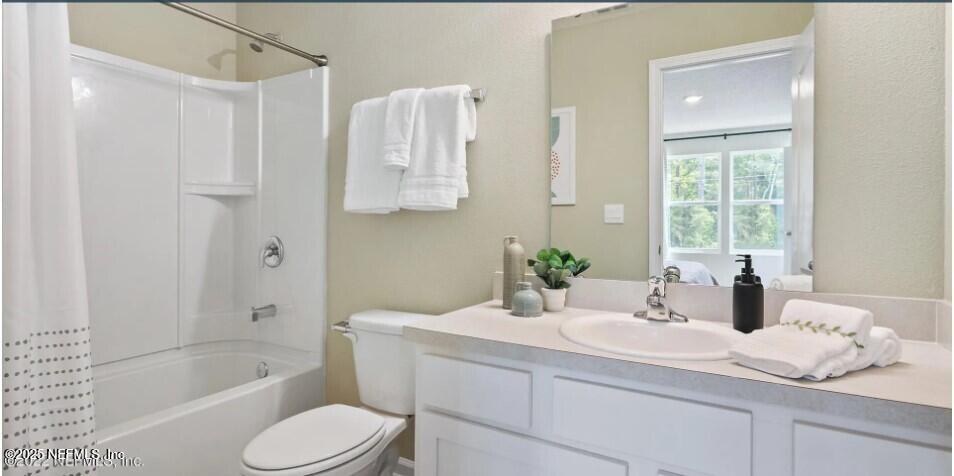 67 Blue Hvn Road St. Augustine, FL 32095 - Photo 8 of 24 a bathroom with a granite countertop sink toilet and shower