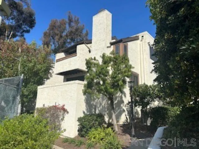 2258 Caminito Pescado, Unit 11 San Diego, CA 92107 - Photo 1 of 13 a view of a yard with plants and trees