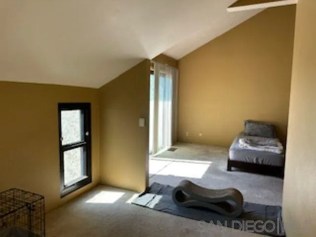 2258 Caminito Pescado, Unit 11 San Diego, CA 92107 - Photo 5 of 13 a living room with furniture and a window