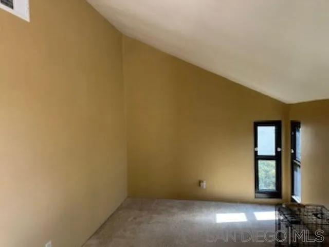 2258 Caminito Pescado, Unit 11 San Diego, CA 92107 - Photo 6 of 13 a view of an empty room with a window