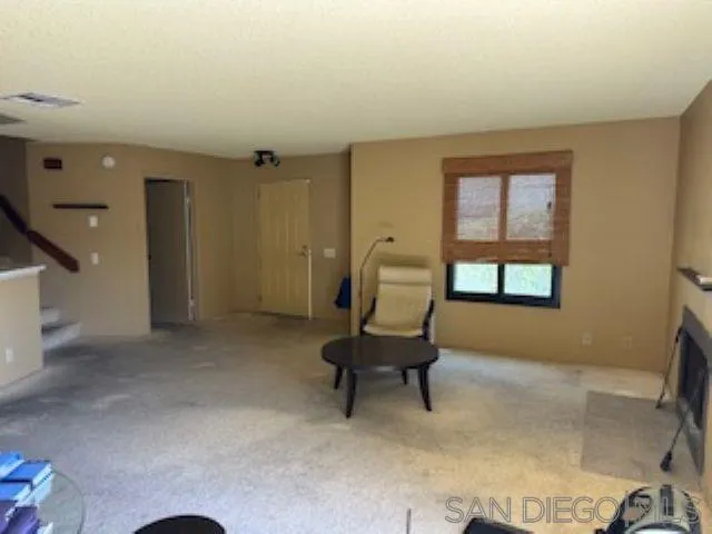 2258 Caminito Pescado, Unit 11 San Diego, CA 92107 - Photo 10 of 13 a view of a workspace with furniture and a window