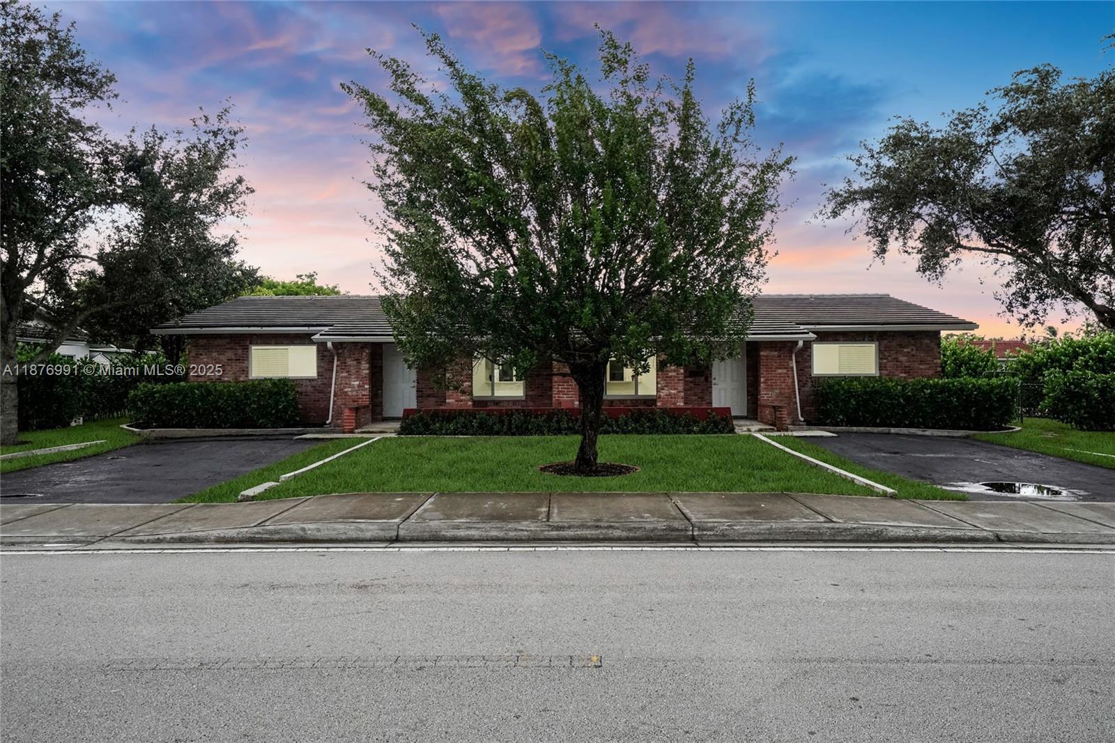 7516 Northwest 44th Court, Unit B Coral Springs, FL 33065 - Photo 1 of 26 a view of road with a house in the background