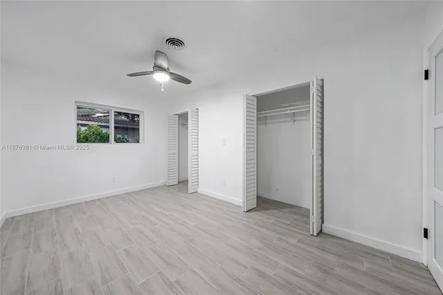 a view of hallway with window and entryway
