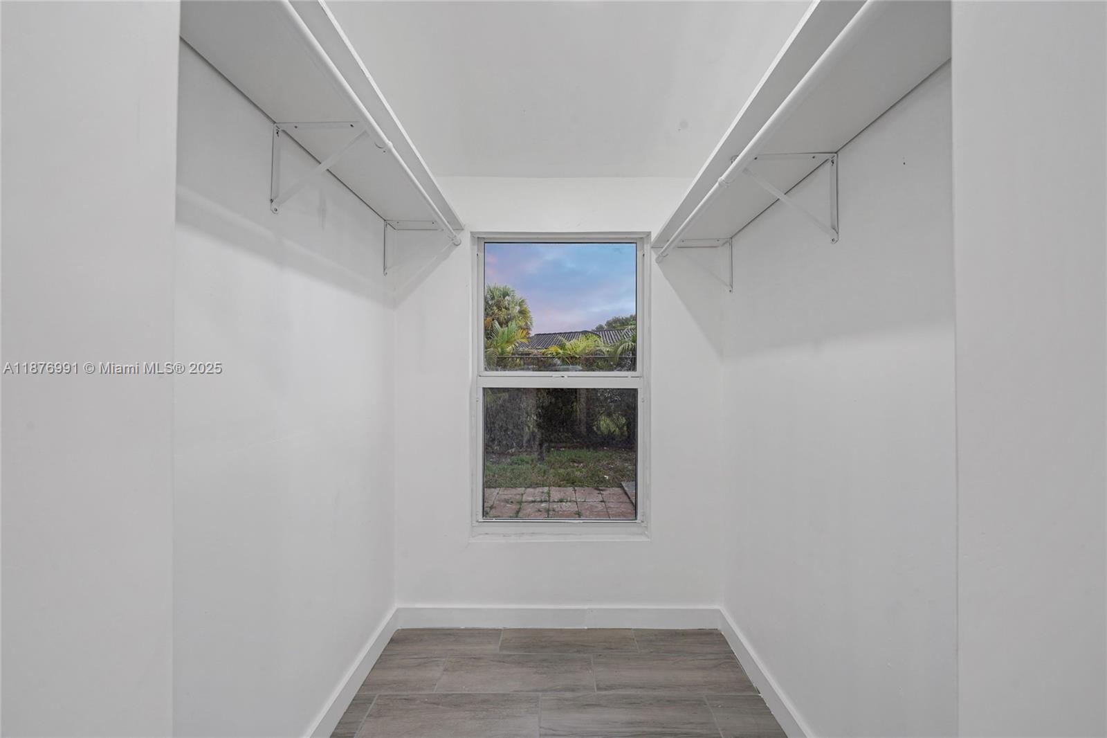 7516 Northwest 44th Court, Unit B Coral Springs, FL 33065 - Photo 12 of 26 a view of hallway with window and entryway