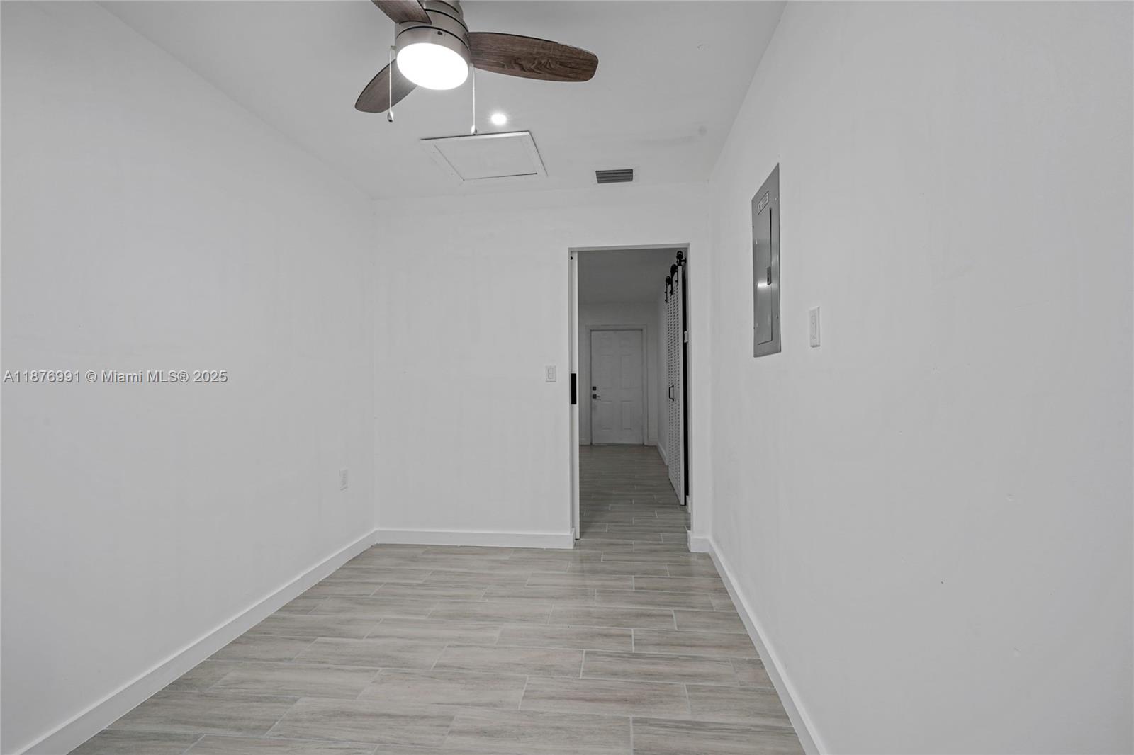 7516 Northwest 44th Court, Unit B Coral Springs, FL 33065 - Photo 14 of 26 a view of a hallway with wooden floor