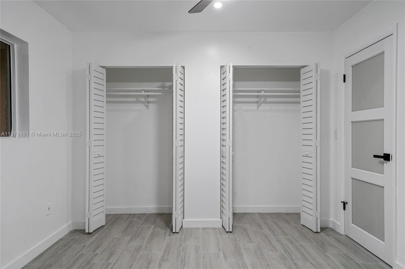 7516 Northwest 44th Court, Unit B Coral Springs, FL 33065 - Photo 18 of 26 an empty room with wooden floor and closet