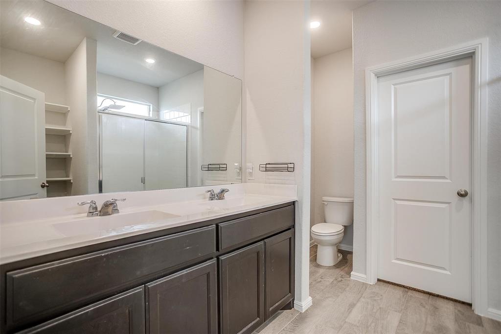 9721 Cherryville Road Fort Worth, TX 76108 - Photo 10 of 23 Primary bath with dual sinks and walk-in shower.