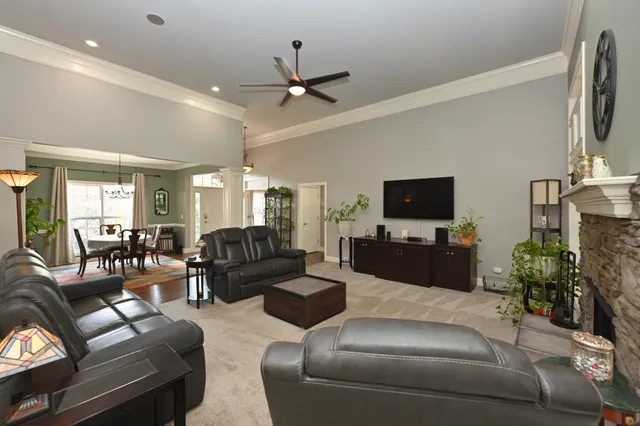 a view of a livingroom with furniture window and wooden floor
