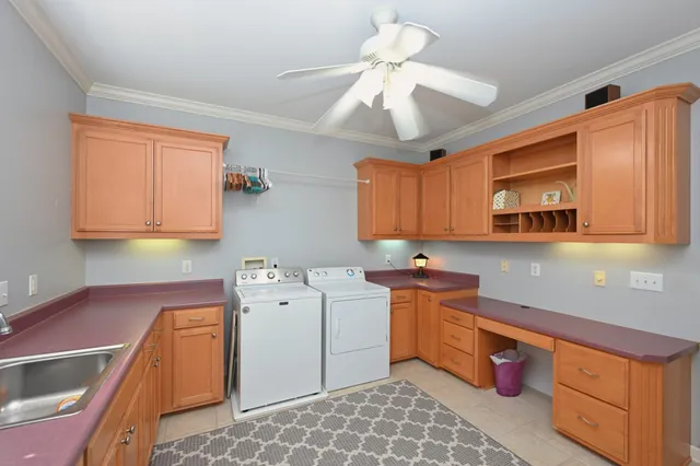 a bathroom with a granite countertop sink mirror and a toilet