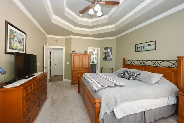 a bathroom with a granite countertop sink mirror and a bathtub