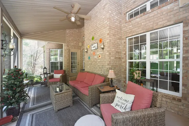 a view of a backyard with sitting area