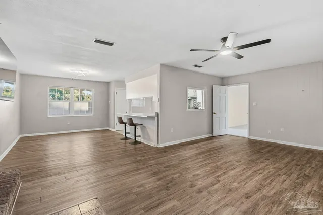 a kitchen with stainless steel appliances a refrigerator and a stove top oven