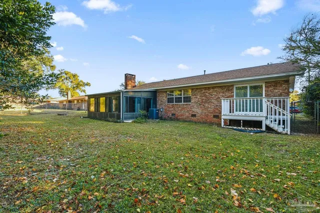an aerial view of residential houses with outdoor space and swimming pool