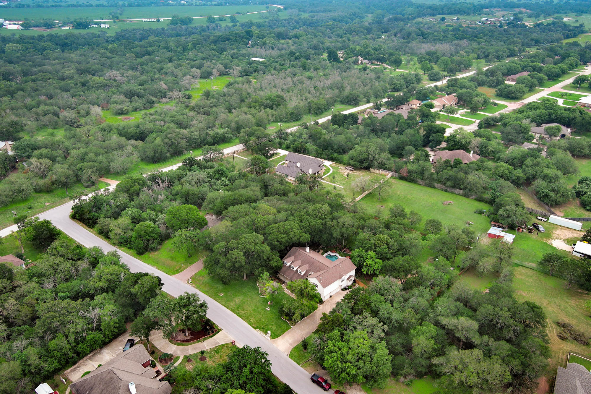 147 Spring Meadow Road Bastrop, TX 78602 - Photo 40 of 40 Aerial perspective showcasing a residential area with extensive green space