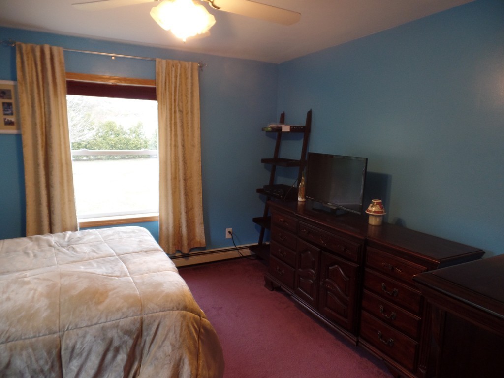 207 Turnpike Road Montague, MA 01376 - Photo 13 of 22 a bedroom with a bed and a window