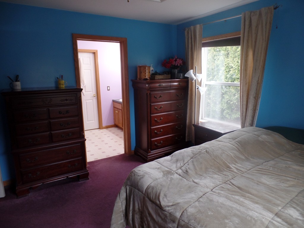 207 Turnpike Road Montague, MA 01376 - Photo 14 of 22 a bedroom with a bed and a window