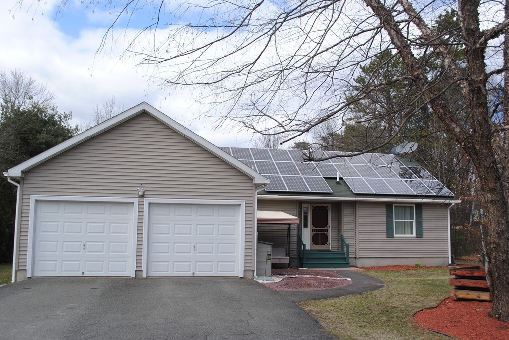 207 Turnpike Road Montague, MA 01376 - Photo 2 of 22 a front view of a house with yard and parking