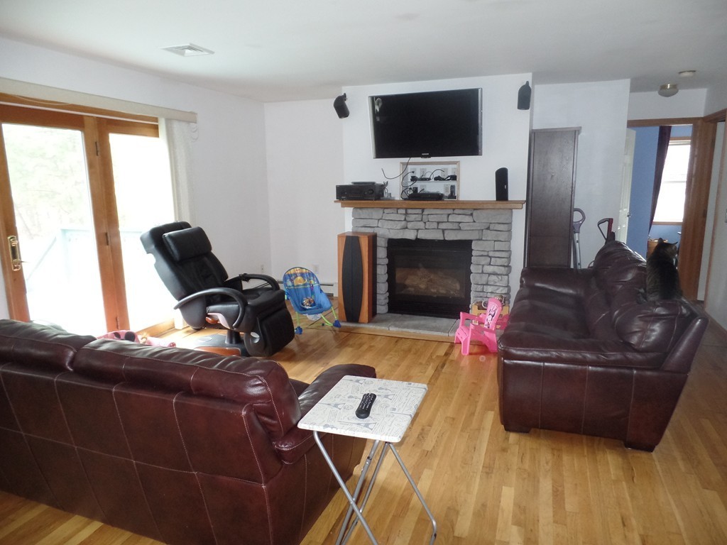 207 Turnpike Road Montague, MA 01376 - Photo 3 of 22 a living room with furniture and a flat screen tv