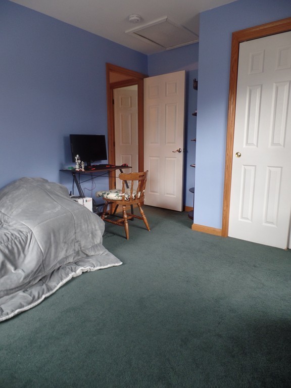 207 Turnpike Road Montague, MA 01376 - Photo 6 of 22 a bed room with a bed and a television