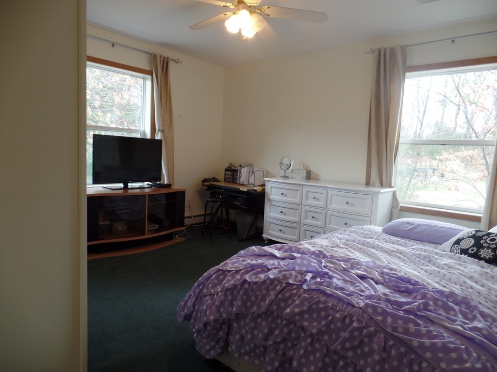 207 Turnpike Road Montague, MA 01376 - Photo 7 of 22 a bedroom with a bed and a window