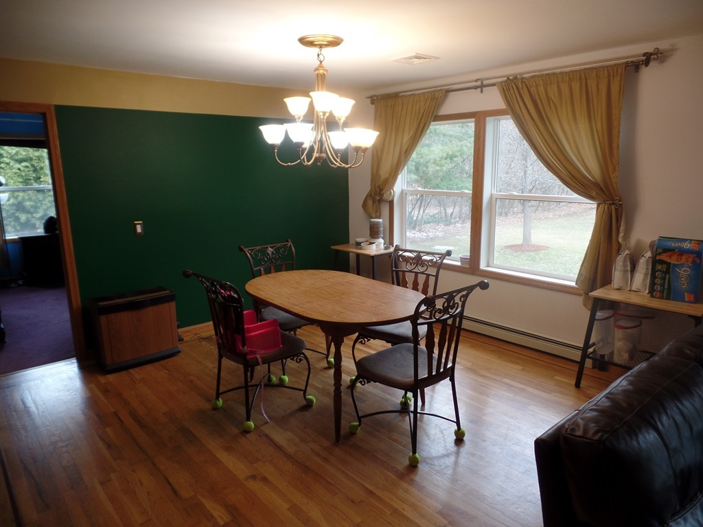 207 Turnpike Road Montague, MA 01376 - Photo 8 of 22 a view of a dining room with furniture window and wooden floor