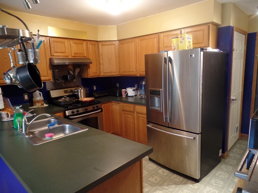 207 Turnpike Road Montague, MA 01376 - Photo 10 of 22 a kitchen with stainless steel appliances a refrigerator and a stove