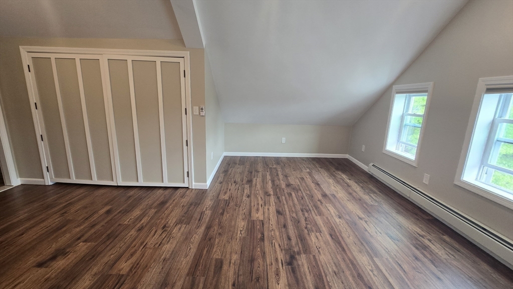 15 Central Street, Unit 4 Georgetown, MA 01833 - Photo 17 of 24 an empty room with wooden floor and windows