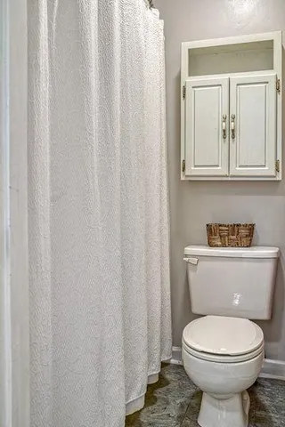 a bathroom with a toilet and a sink