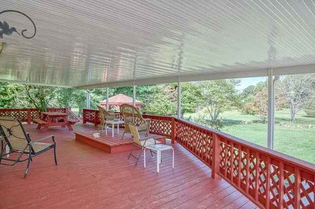 a view of a chairs with an umbrella in the balcony