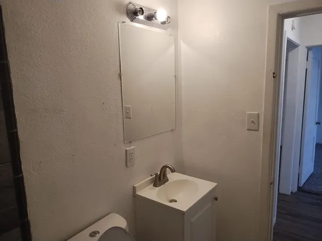 a bathroom with a sink and mirror