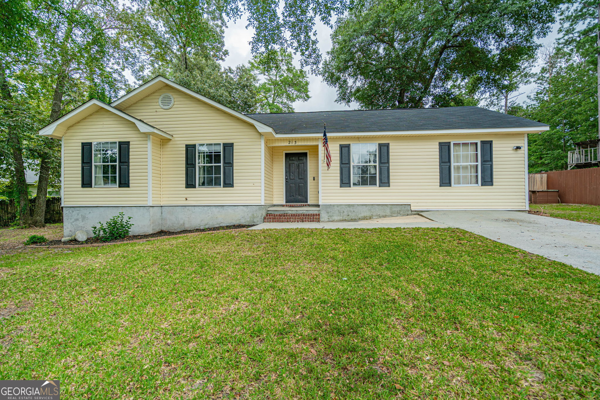 213 Doe Circle Springfield, GA 31329 - Photo 1 of 1 a front view of house with yard and green space