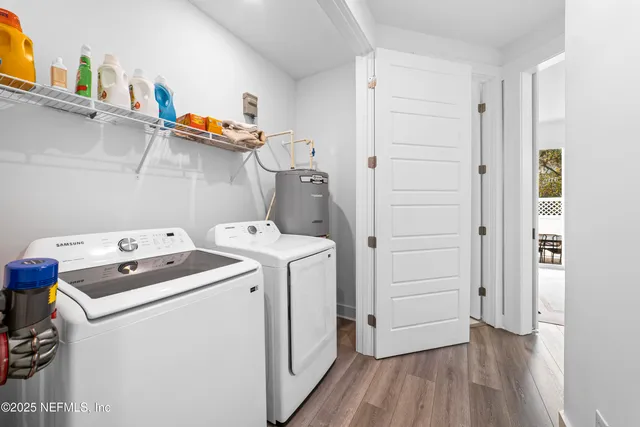 a view of storage and utility room with washer and dryer