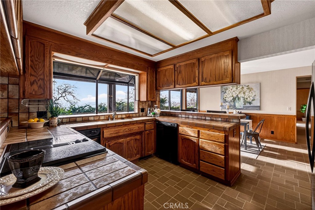 4139 Hidden Valley Road Butte Valley, CA 95965 - Photo 13 of 75 a kitchen with stainless steel appliances granite countertop a stove a sink and a microwave