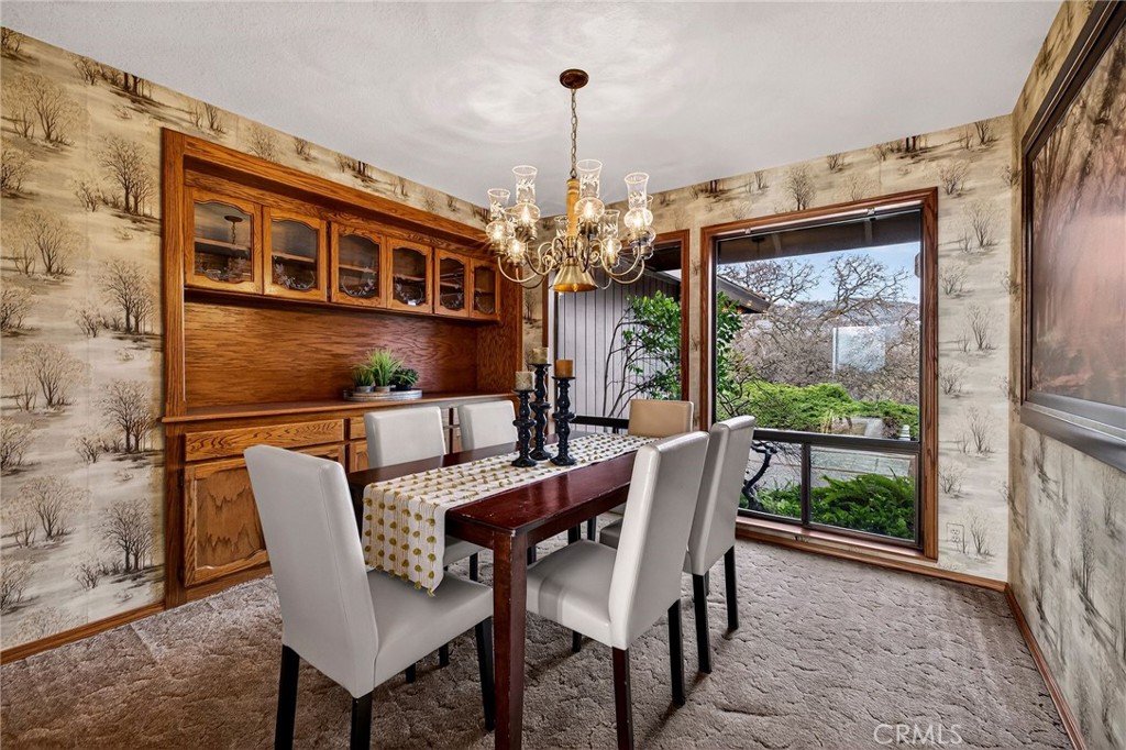 4139 Hidden Valley Road Butte Valley, CA 95965 - Photo 16 of 75 a dining room with furniture a chandelier and window