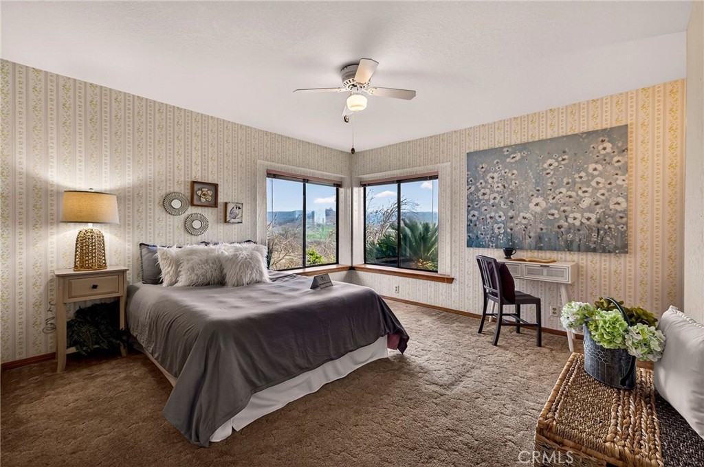 4139 Hidden Valley Road Butte Valley, CA 95965 - Photo 21 of 75 a bedroom with a bed and a chandelier