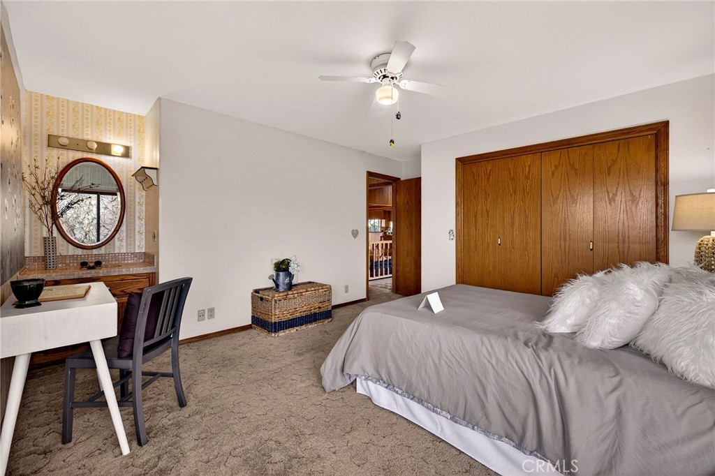 4139 Hidden Valley Road Butte Valley, CA 95965 - Photo 23 of 75 a bedroom with a bed a desk and chair