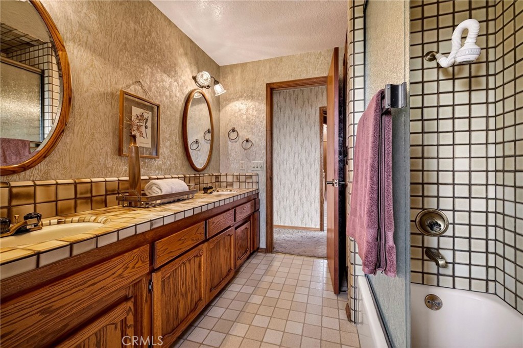 4139 Hidden Valley Road Butte Valley, CA 95965 - Photo 25 of 75 a bathroom with a double vanity sink and a mirror