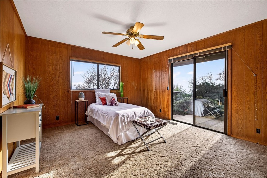 4139 Hidden Valley Road Butte Valley, CA 95965 - Photo 27 of 75 a bedroom with a bed and a large window