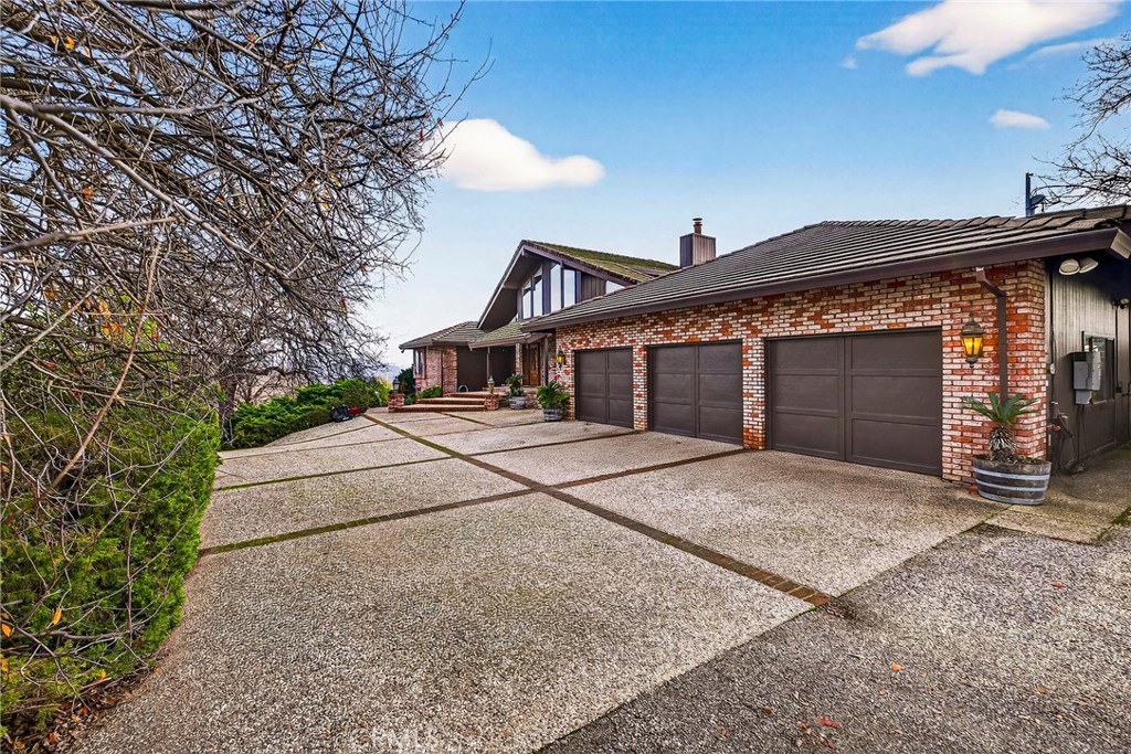 4139 Hidden Valley Road Butte Valley, CA 95965 - Photo 3 of 75 a front view of a house with a yard and garage