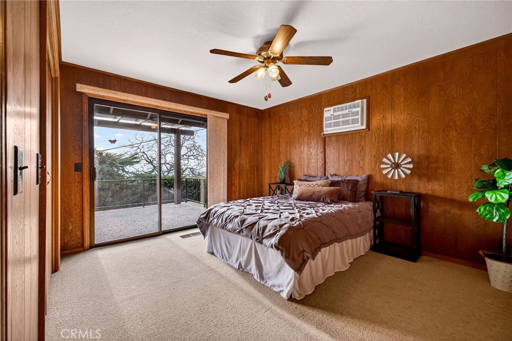 4139 Hidden Valley Road Butte Valley, CA 95965 - Photo 31 of 75 a bed room with a bed and a chandelier