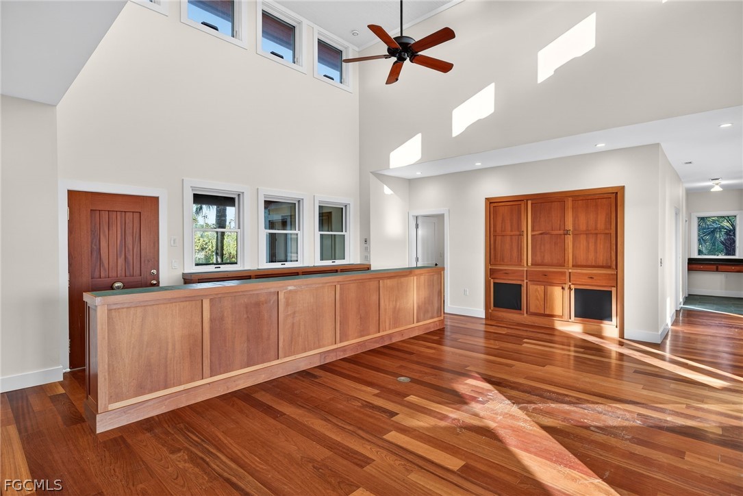 5703 Sanibel Captiva Road Sanibel, FL 33957 - Photo 17 of 50 a view of an empty room with wooden floor and a window