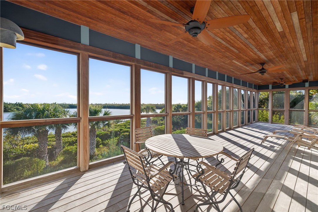 5703 Sanibel Captiva Road Sanibel, FL 33957 - Photo 2 of 50 a view of a porch and wooden floor