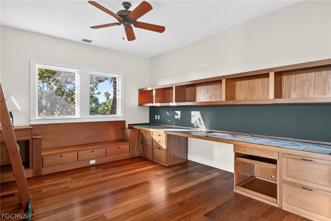5703 Sanibel Captiva Road Sanibel, FL 33957 - Photo 24 of 50 a kitchen with stainless steel appliances granite countertop a stove a sink and a refrigerator