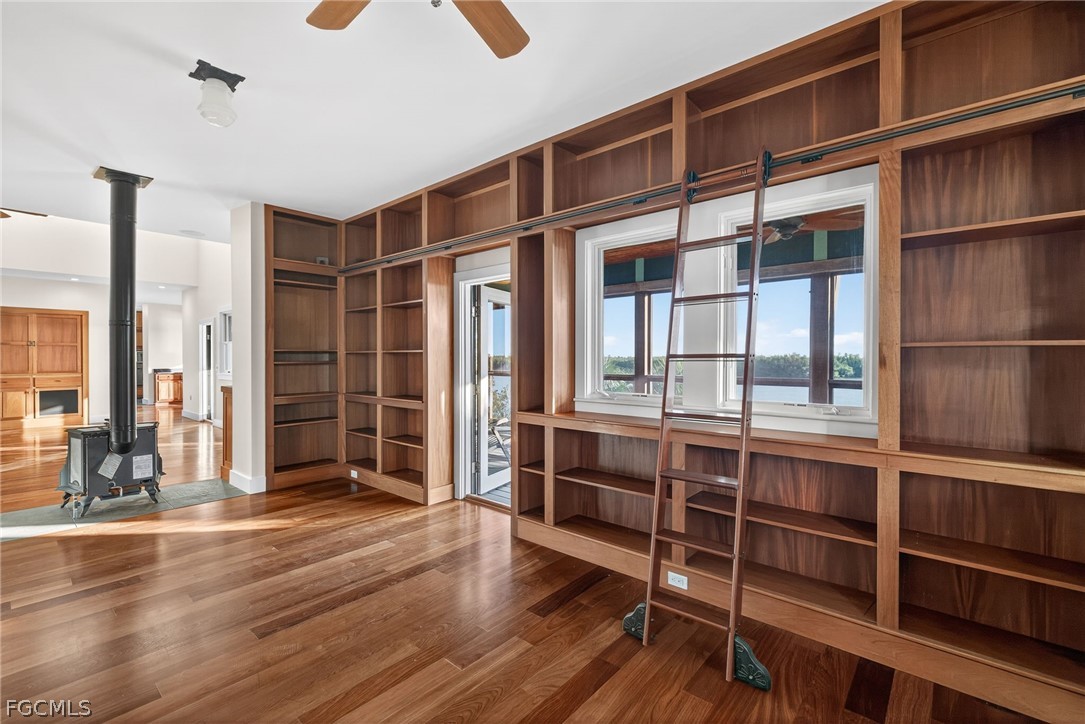 5703 Sanibel Captiva Road Sanibel, FL 33957 - Photo 25 of 50 a view of empty room with wooden floor and windows