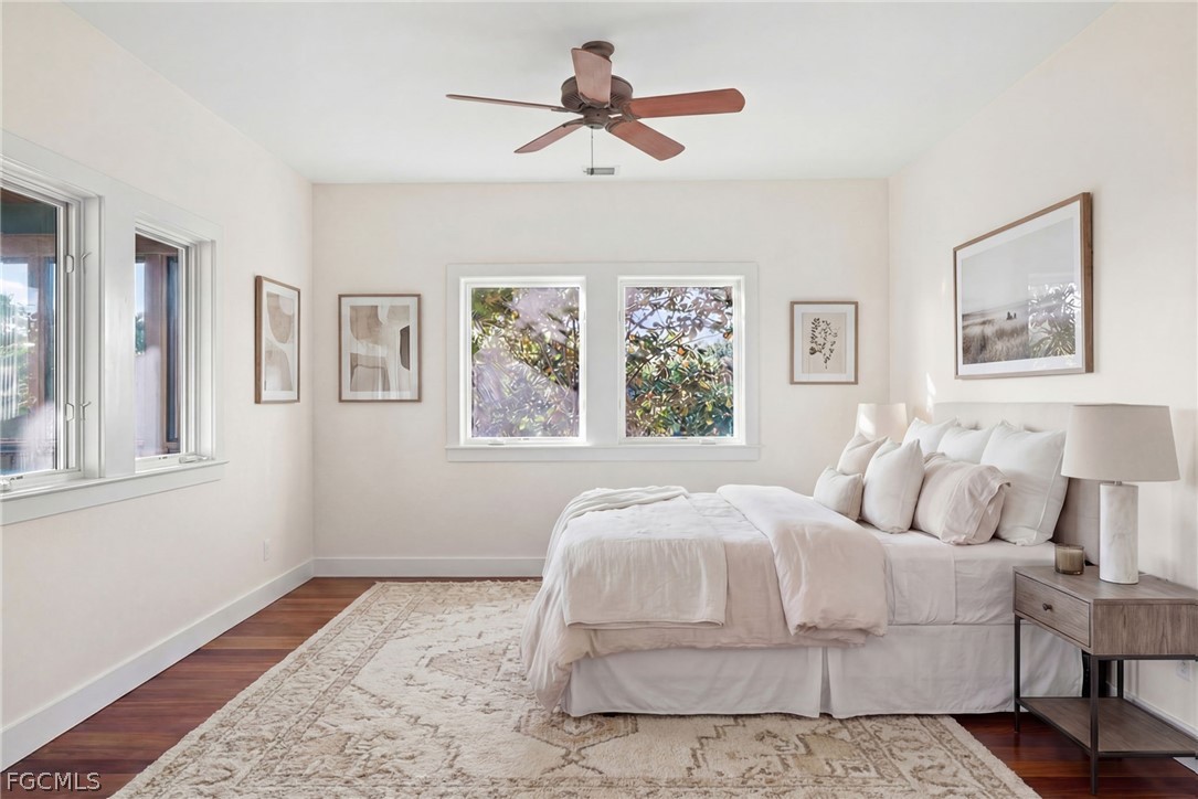 5703 Sanibel Captiva Road Sanibel, FL 33957 - Photo 26 of 50 a bedroom with a large bed and a window