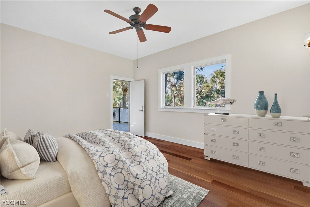 5703 Sanibel Captiva Road Sanibel, FL 33957 - Photo 27 of 50 a bedroom with a large bed and a window