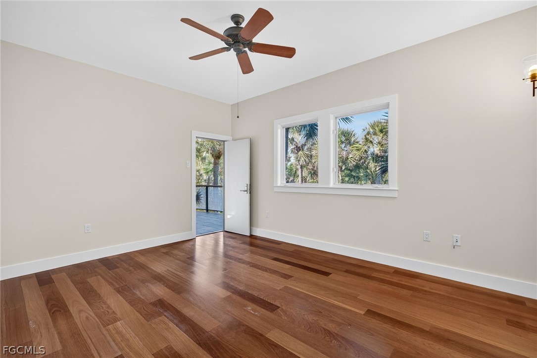 5703 Sanibel Captiva Road Sanibel, FL 33957 - Photo 29 of 50 a view of empty room with wooden floor and window