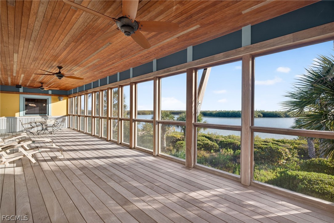 5703 Sanibel Captiva Road Sanibel, FL 33957 - Photo 3 of 50 a view of a balcony with wooden floor